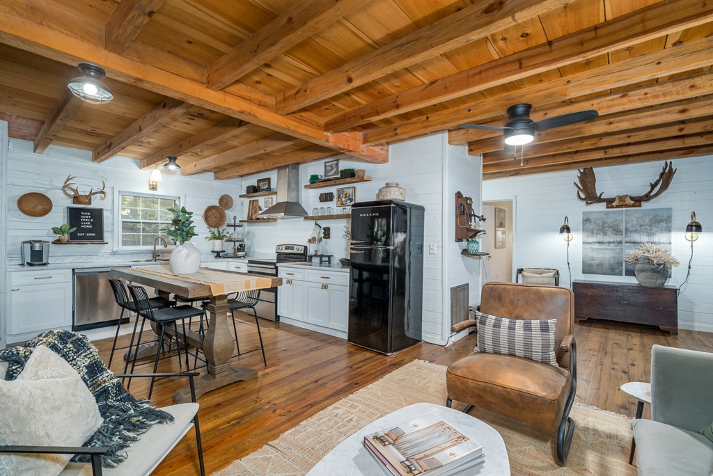 250 Chinkapin Drive Blue Ridge, GA 30513 - Photo 25 of 50 a dining room with furniture and a kitchen view