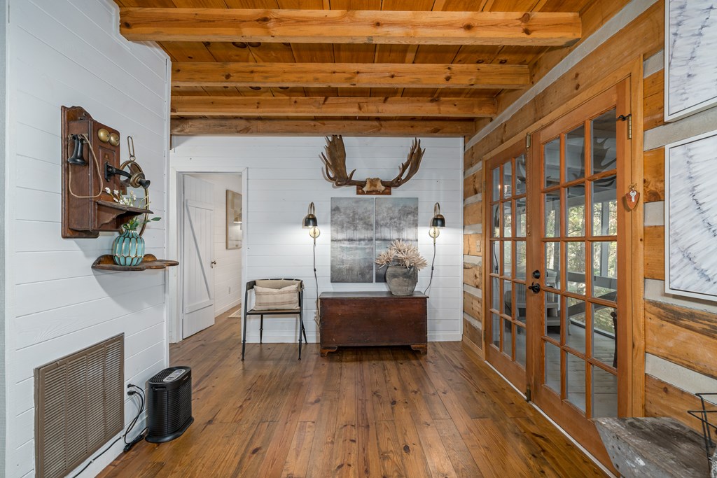 250 Chinkapin Drive Blue Ridge, GA 30513 - Photo 27 of 50 a bedroom with furniture and wooden floor