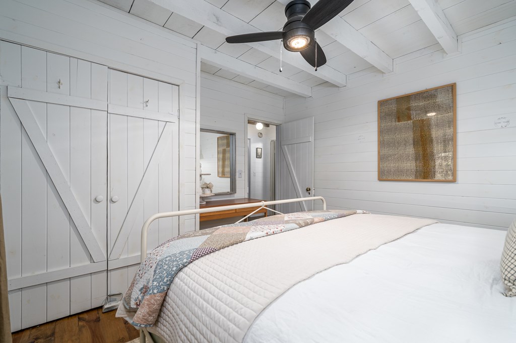 250 Chinkapin Drive Blue Ridge, GA 30513 - Photo 31 of 50 a bedroom with a bed and a chandelier