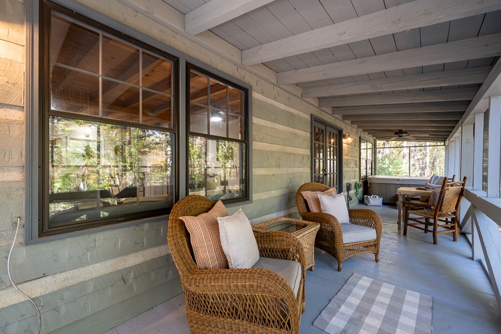 250 Chinkapin Drive Blue Ridge, GA 30513 - Photo 38 of 50 a living room with furniture and a floor to ceiling window