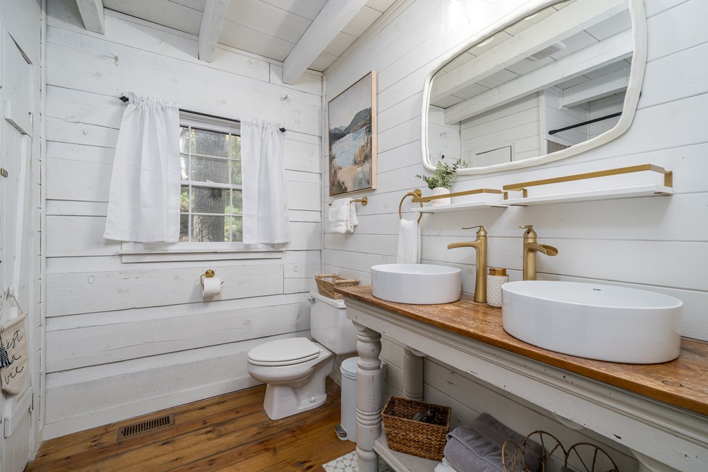 250 Chinkapin Drive Blue Ridge, GA 30513 - Photo 5 of 50 a bathroom with a granite countertop sink and a toilet