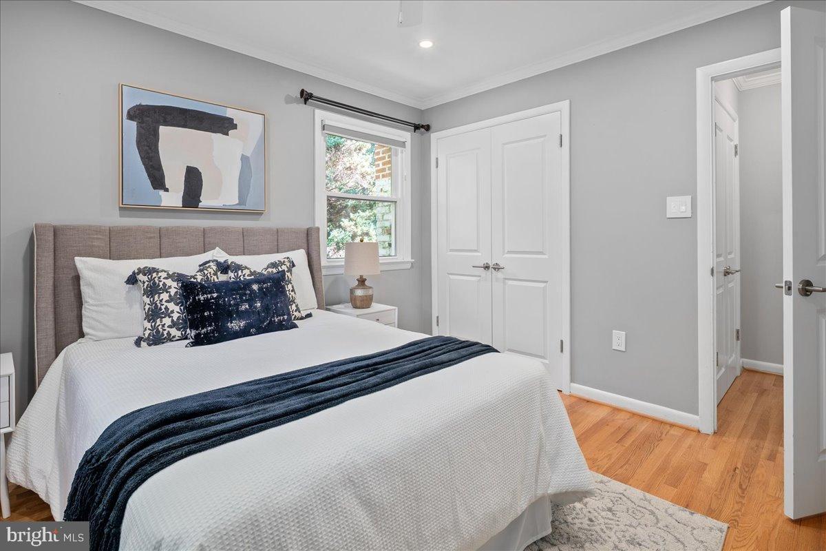 9515 Stevebrook Road Fairfax, VA 22032 - Photo 15 of 25 a bedroom with a bed and a painting on the wall