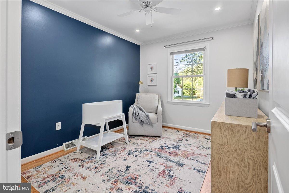 9515 Stevebrook Road Fairfax, VA 22032 - Photo 17 of 25 a living room with a couch and a window