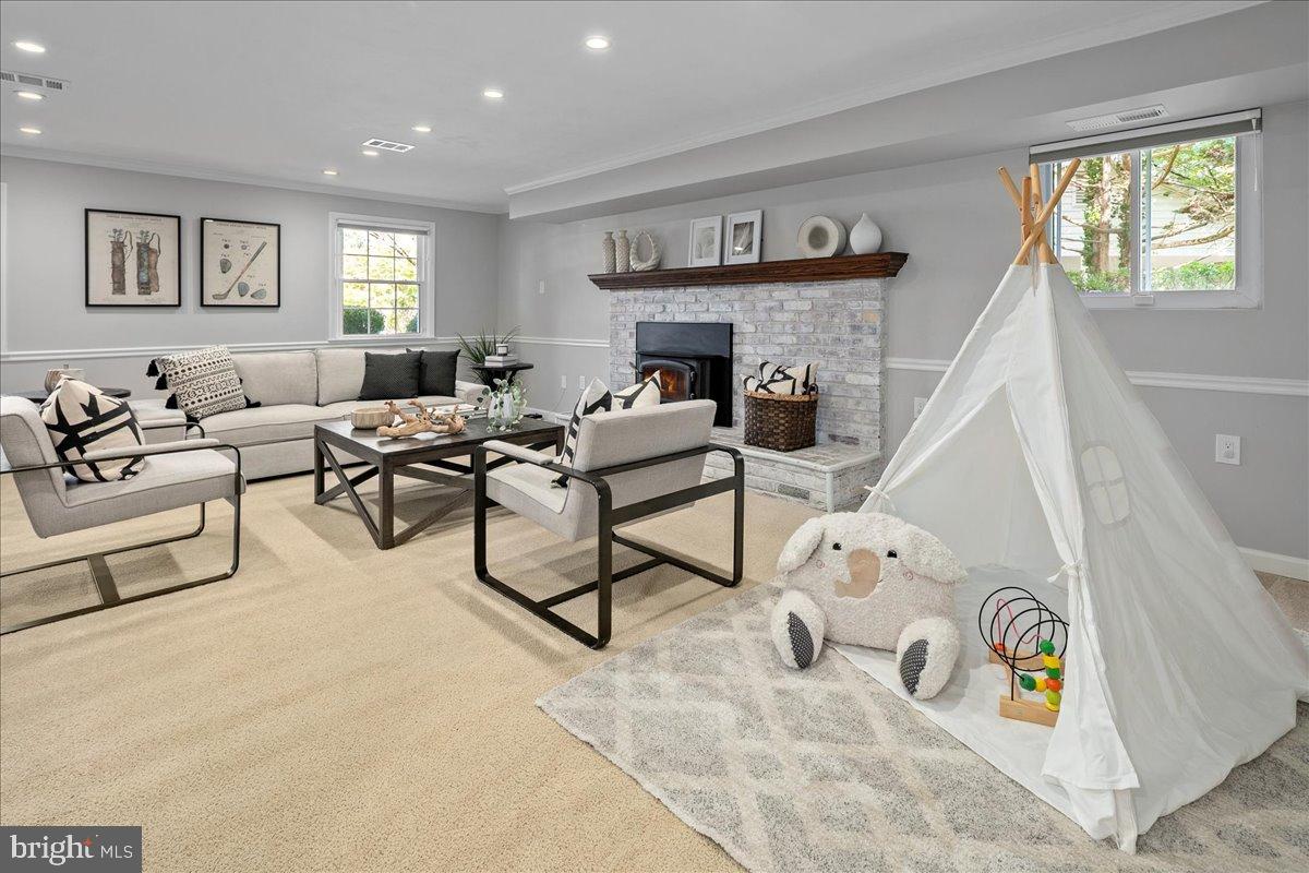 9515 Stevebrook Road Fairfax, VA 22032 - Photo 19 of 25 a living room with furniture and a fireplace