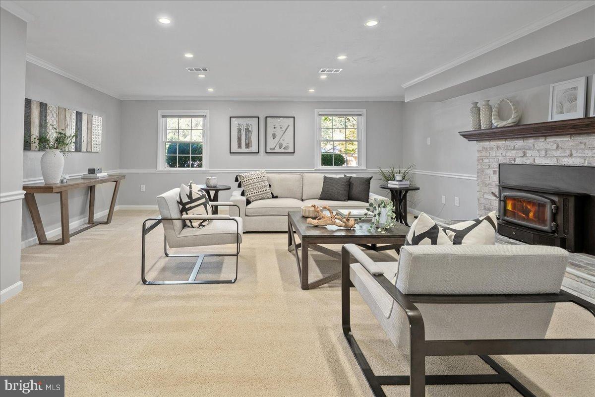 9515 Stevebrook Road Fairfax, VA 22032 - Photo 20 of 25 a living room with furniture and a fireplace