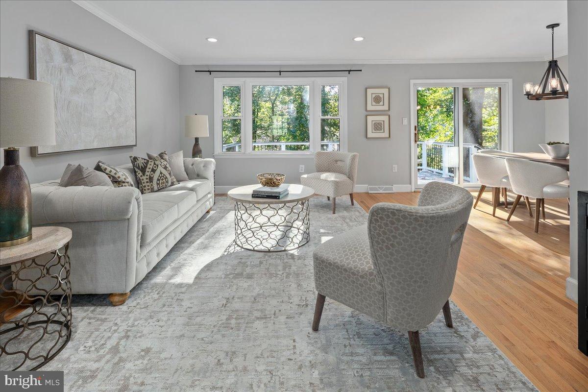 9515 Stevebrook Road Fairfax, VA 22032 - Photo 2 of 25 a living room with fireplace furniture and a large window