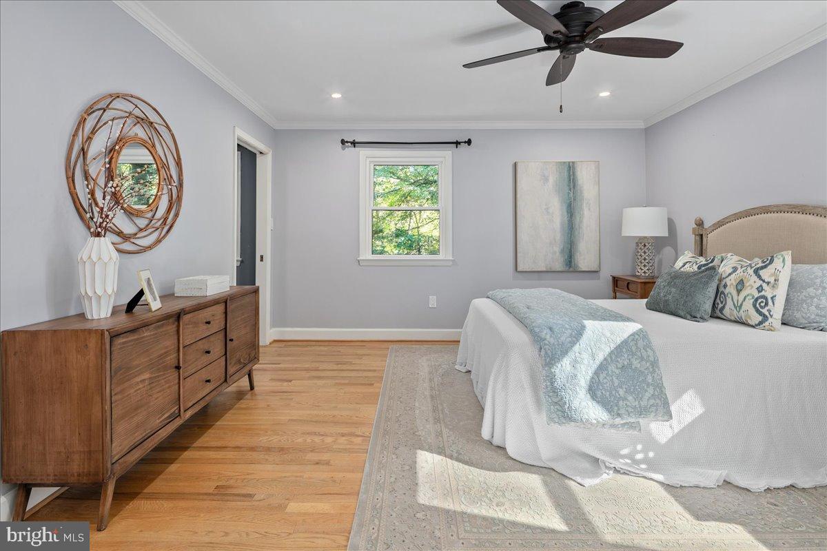 9515 Stevebrook Road Fairfax, VA 22032 - Photo 9 of 25 a bed room with a bed and a chandelier