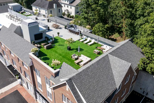 an aerial view of house with yard