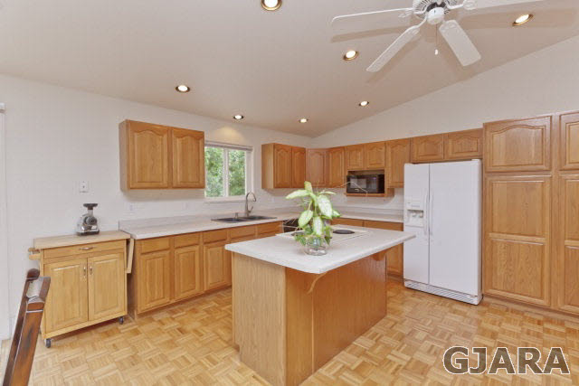 2391 H Road Grand Junction, CO 81505 - Photo 12 of 33 a view of a kitchen with stainless steel appliances granite countertop a refrigerator and a sink