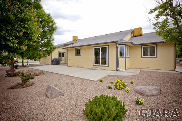 2391 H Road Grand Junction, CO 81505 - Photo 27 of 33 a front view of a house with a yard