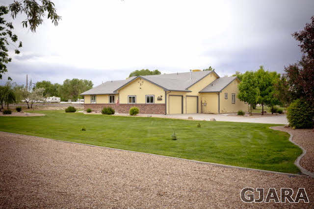 2391 H Road Grand Junction, CO 81505 - Photo 5 of 33 a view of a house with a yard