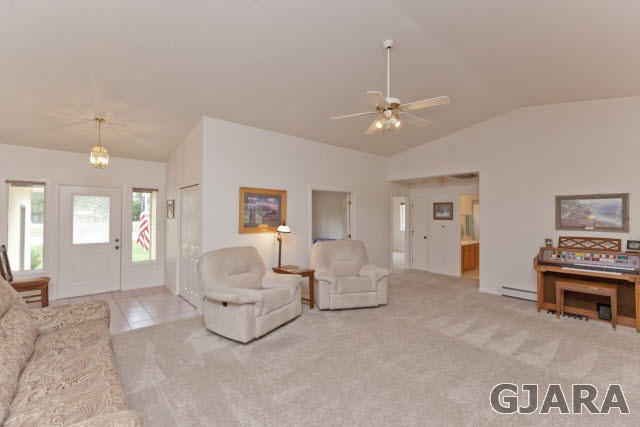 2391 H Road Grand Junction, CO 81505 - Photo 6 of 33 a living room with furniture and a chandelier