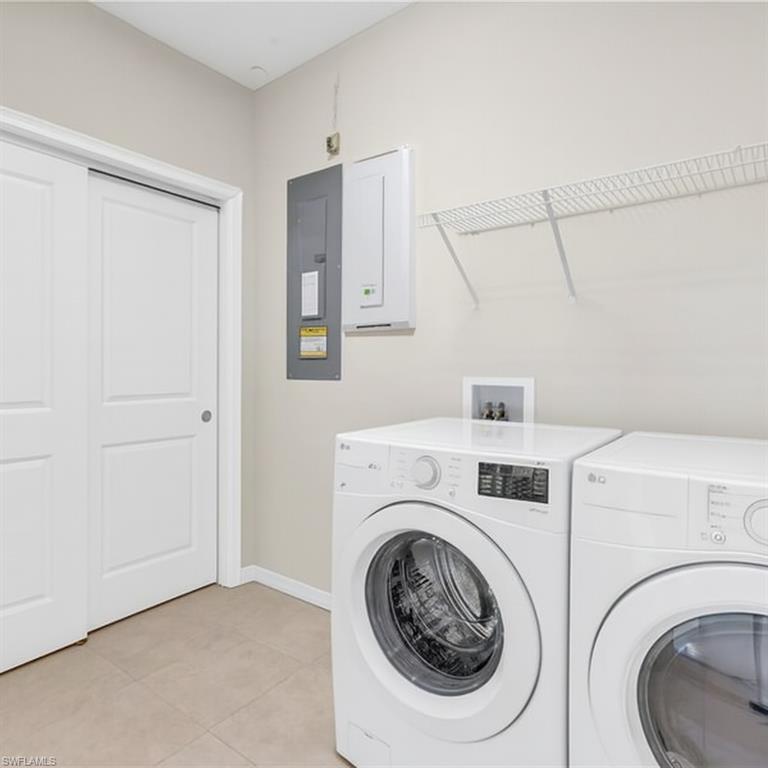 9385 Pocida Court, Unit 101 Naples, FL 34119 - Photo 21 of 26 a utility room with dryer and washer