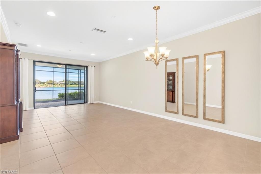 9385 Pocida Court, Unit 101 Naples, FL 34119 - Photo 8 of 26 a view of an empty room with a window