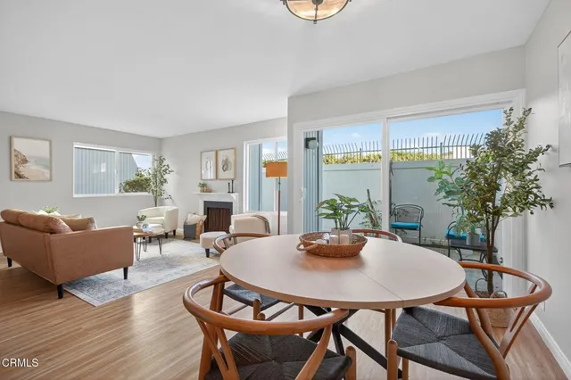 a living room with furniture fireplace and window