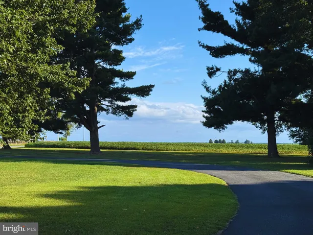 a view of a golf course with a lake view