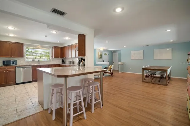 a bed room with a bed and a chandelier