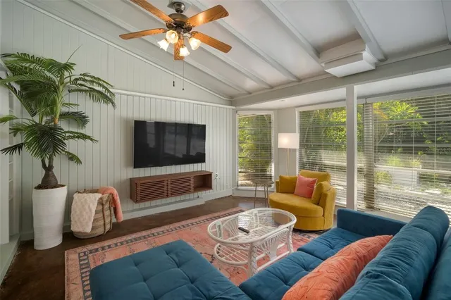 a bathroom with a granite countertop sink a mirror and a shower