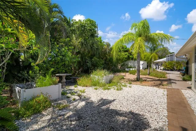 a bedroom with two beds and a window