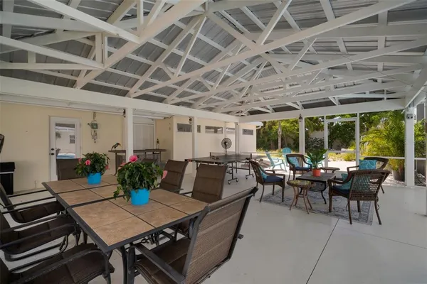 a bed room with a bed and a chair