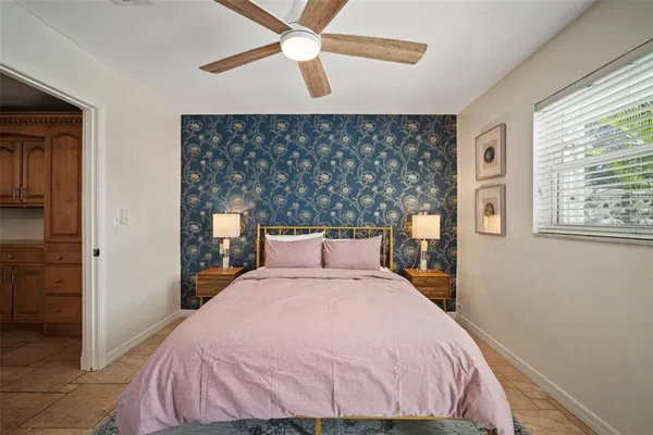 a view of a dining room with furniture large windows and wooden floor