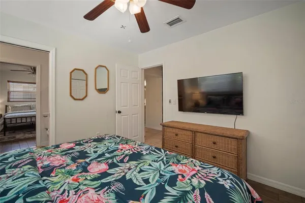a view of a dining room with furniture and floor to ceiling windows