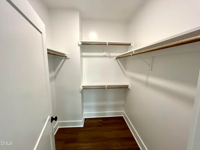 a view of an empty walk in closet