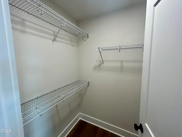 a view of a room with racks on the wall