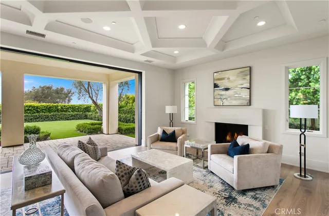 a kitchen with stainless steel appliances a stove a sink a oven a dining table and chairs