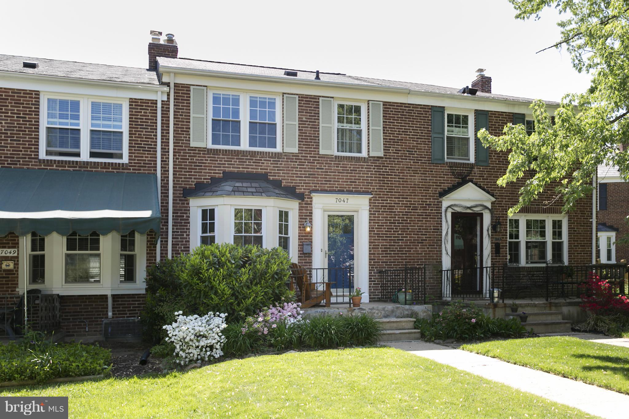 7047 Heathfield Road Baltimore, MD 21212 - Photo 1 of 19 a front view of a house with yard and green space