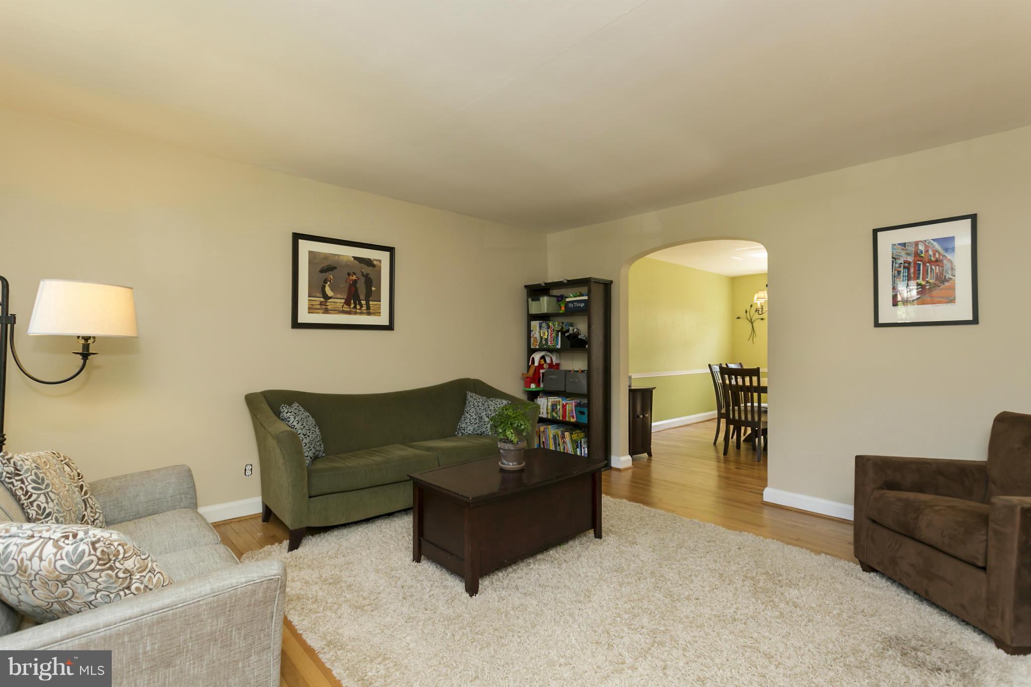 7047 Heathfield Road Baltimore, MD 21212 - Photo 3 of 19 a living room with furniture and a couch
