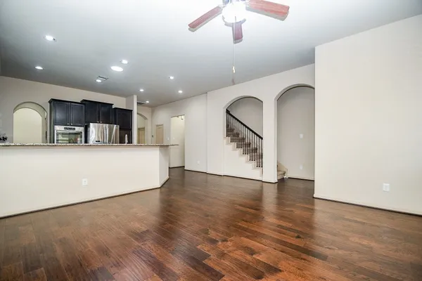 a view of kitchen with cabinets and wooden floor