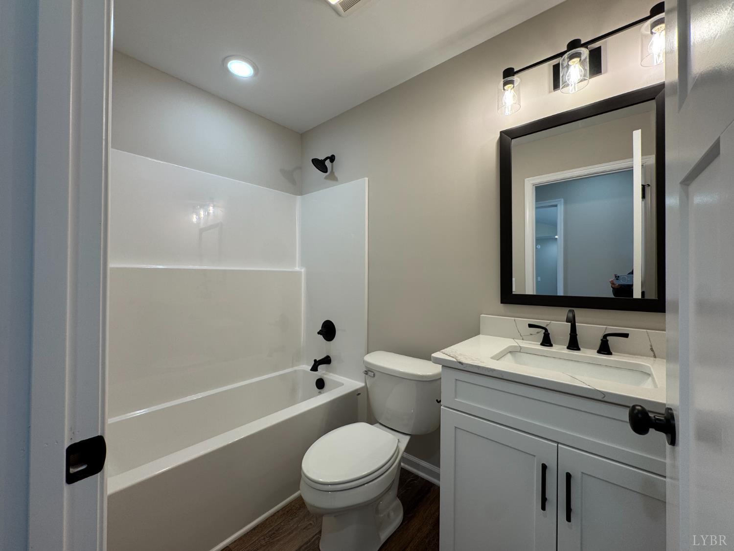 554 Stratford Road Concord, VA 24538 - Photo 13 of 19 a bathroom with a toilet sink and mirror