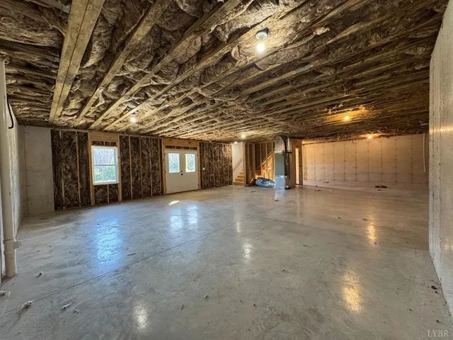 a view of empty room with wooden ceiling