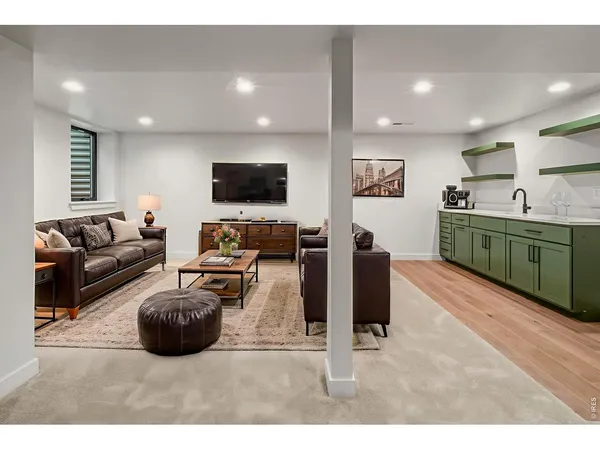 a spacious bedroom with a large bed and a large window