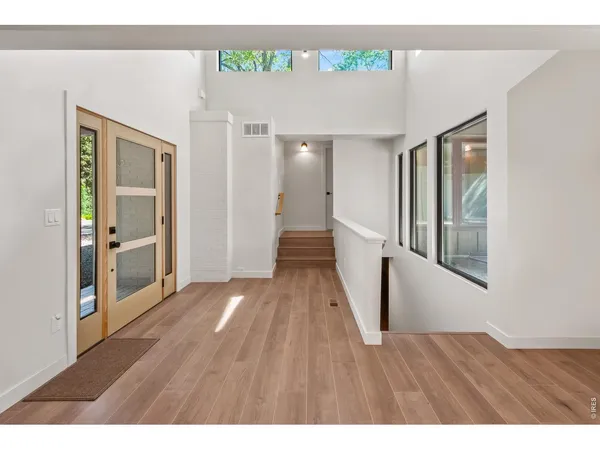 a view of an entryway with wooden floor