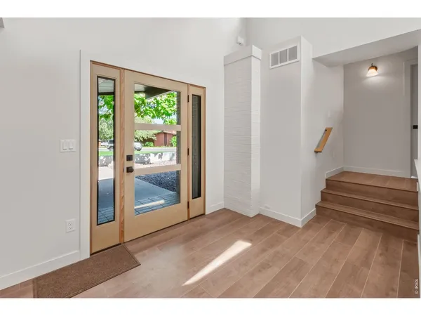 a view of a kitchen cabinets and wooden floor
