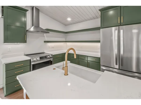 a spacious bathroom with a double vanity sink and a mirror