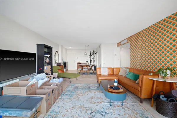 a living room with furniture and a lamp