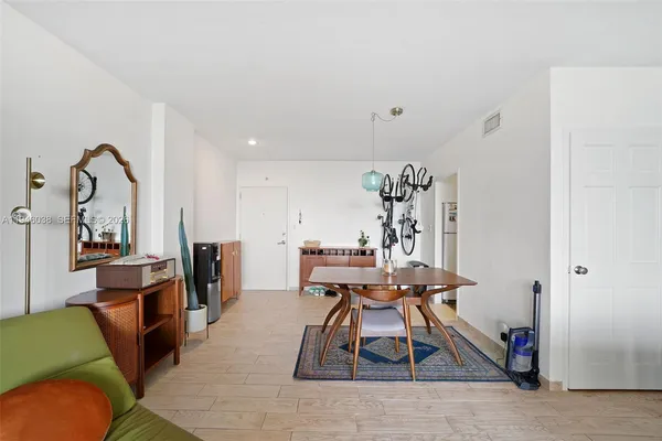 a view of a livingroom with furniture and wooden floor