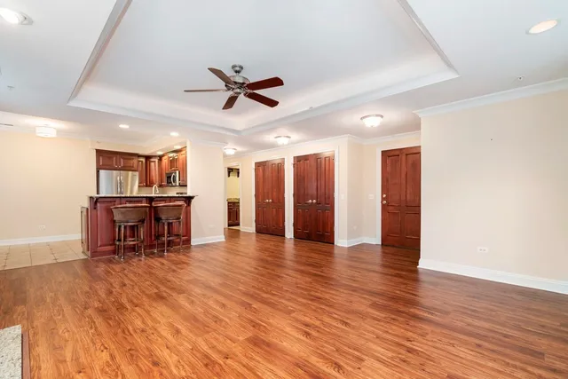a view of a livingroom with furniture and a kitchen