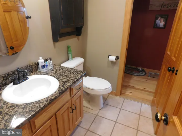 a view of a room with wooden floor and windows