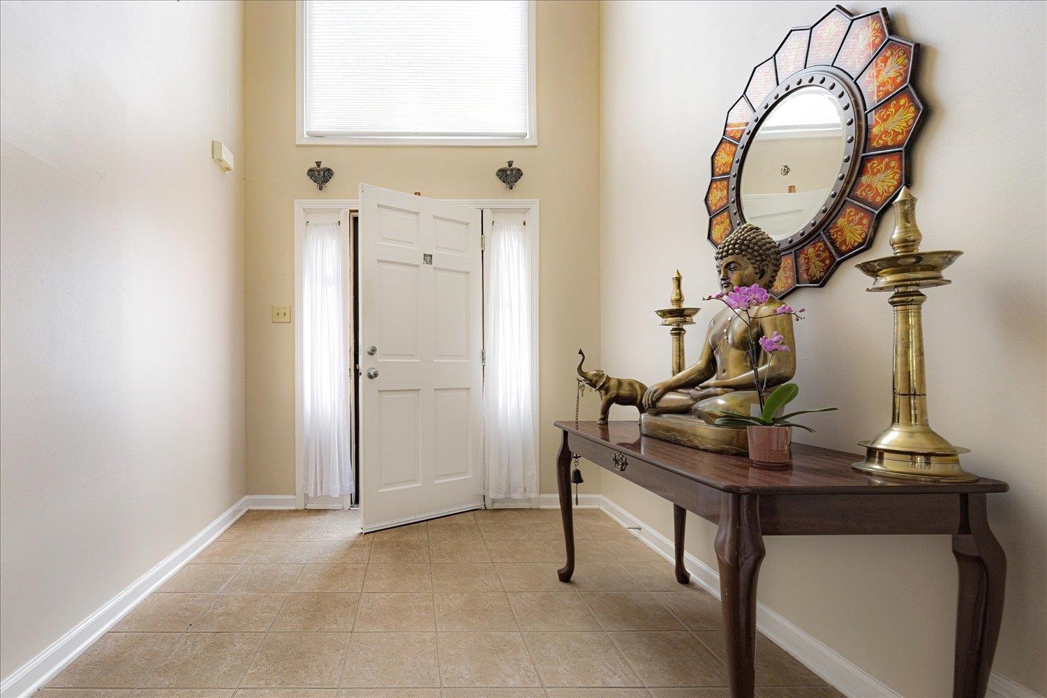 9163 Roundabout Lane Memphis, TN 38018 - Photo 2 of 24 Entrance foyer featuring a towering ceiling and light tile patterned floors