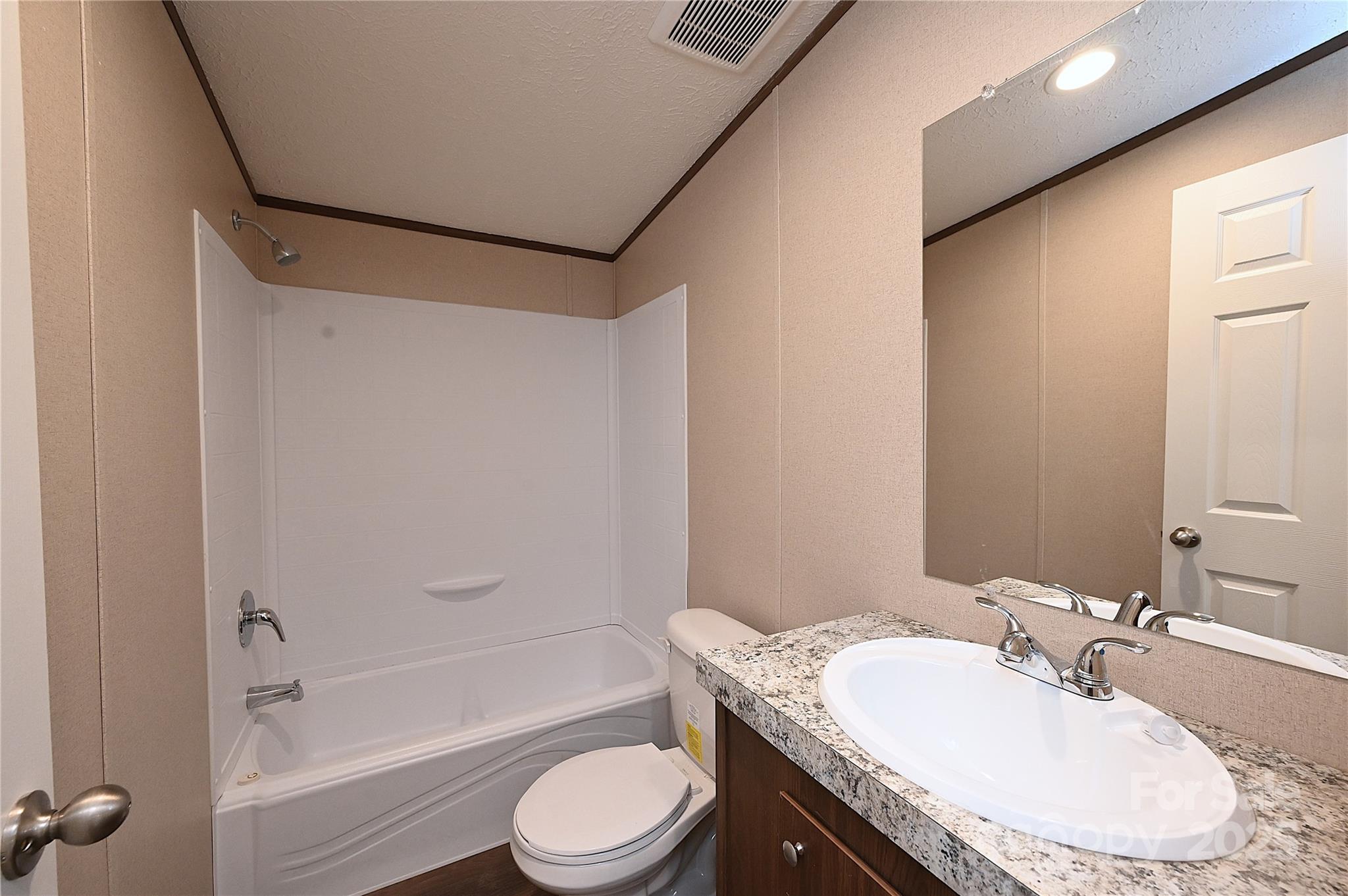 1187 Renno Road Clinton, SC 29325 - Photo 13 of 14 a bathroom with a granite countertop sink toilet and shower