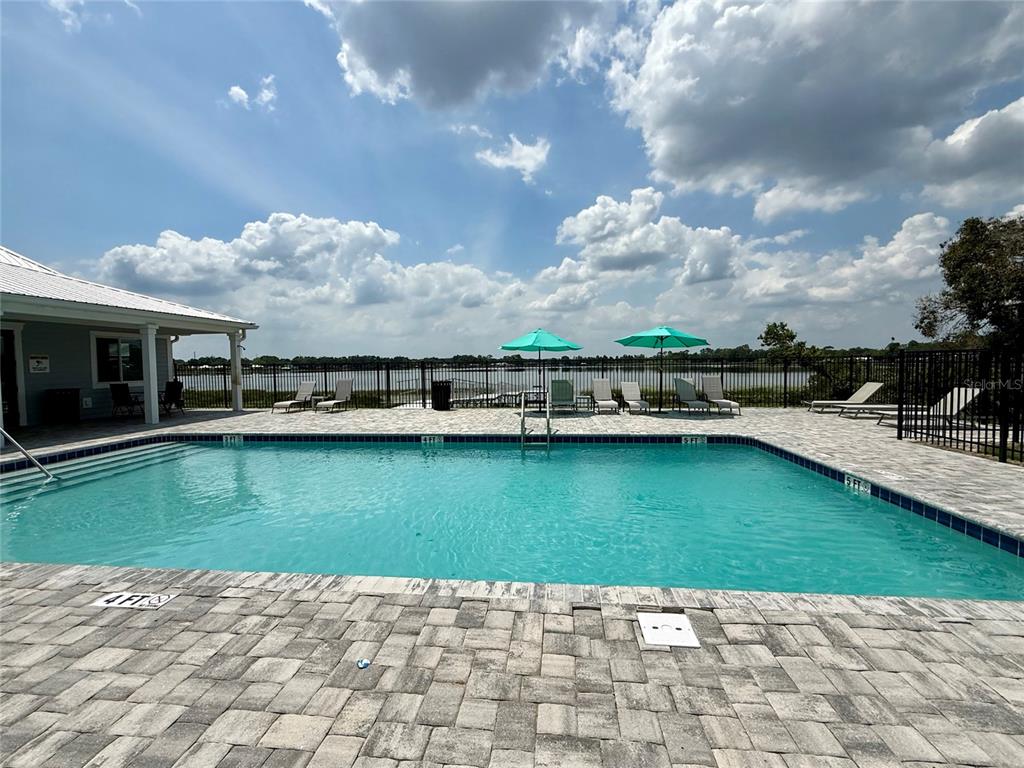 2653 Pine Place Winter Haven, FL 33881 - Photo 22 of 33 a view of a swimming pool with a yard