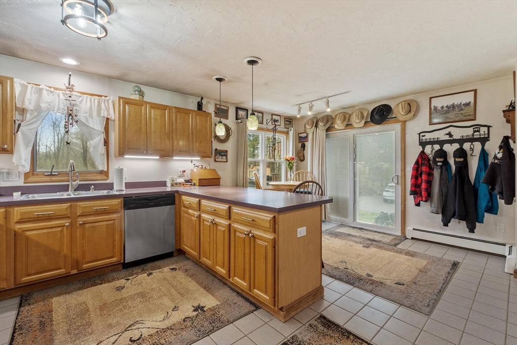 340 Ball Hill Road Princeton, MA 01541 - Photo 23 of 41 a kitchen with stainless steel appliances granite countertop a sink and a refrigerator