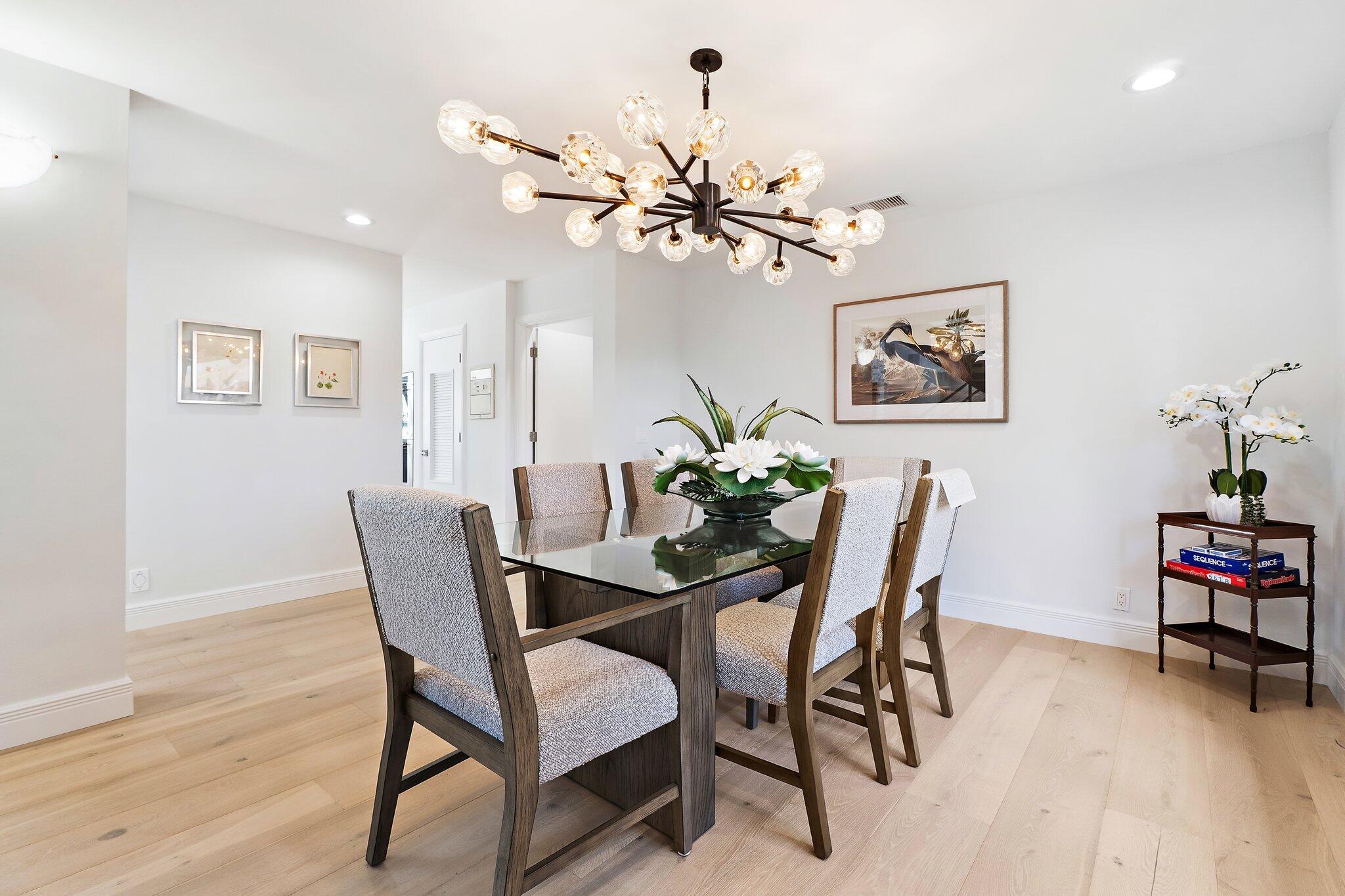 9 North River Road Stuart, FL 34996 - Photo 8 of 24 a dining room with furniture and wooden floor