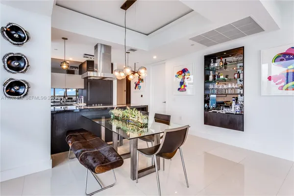a kitchen with a table and chairs in it