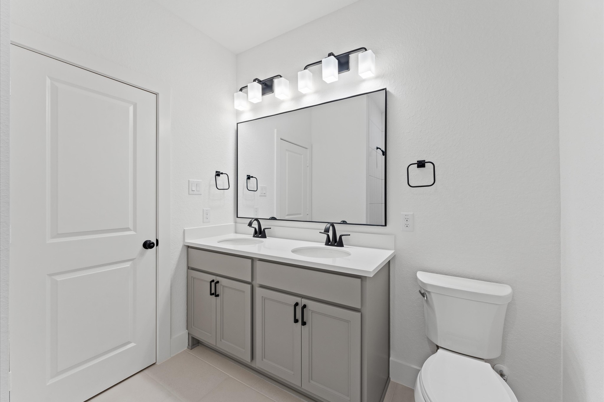 8218 Sherman Pk Trail Spring, TX 77389 - Photo 23 of 28 a bathroom with a toilet sink and mirror