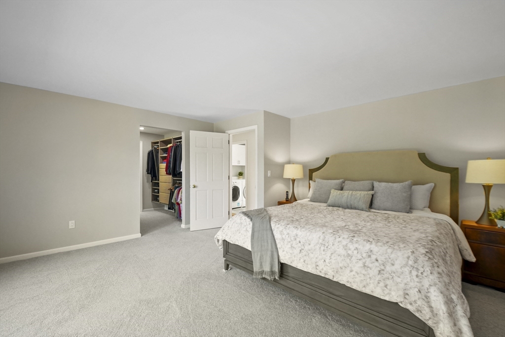 55 Prospect Hill Road Harvard, MA 01451 - Photo 25 of 42 a bedroom with a bed and a lamp
